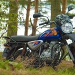 Bajaj boxer 125x motorcycle in the forest
